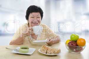 Senior woman having breakfast