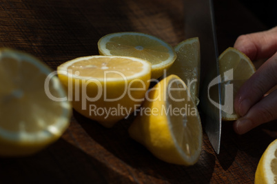 slicing lemons for lemonade refreshments