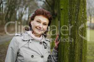 Happy woman smiling in a park