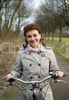 Happy woman riding a bicycle