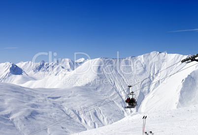 Skiers on ropeway at ski resort Gudauri