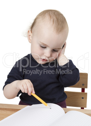 young child at writing desk