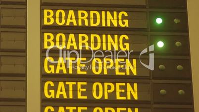 boarding blinking light on airport information board.