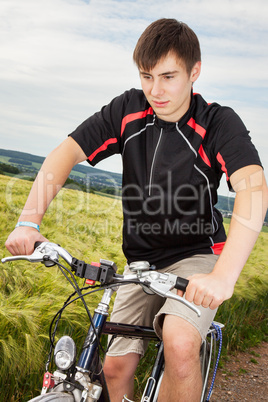 Young man riding a bicycle