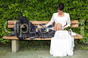 Bridal couple on a park bench