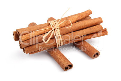 Bunch of cinnamon sticks isolated on white