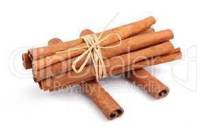 Bunch of cinnamon sticks isolated on white