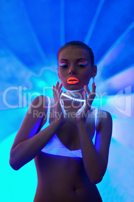 Sexy girl portrait with glow neon make-up