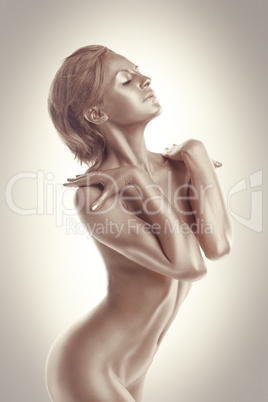 Woman art nude portrait with metal skin