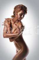 Pretty Woman with metal skin posing nude