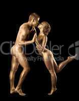 Beauty naked couple dance with gold skin