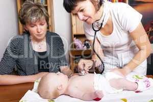 Doctor examines baby