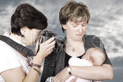 Woman photographed baby in her arms Mother