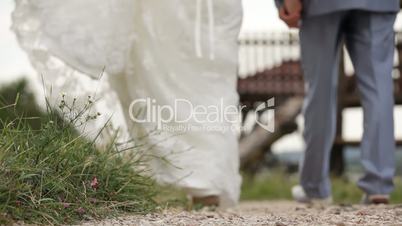 Newlyweds walking hand in hand