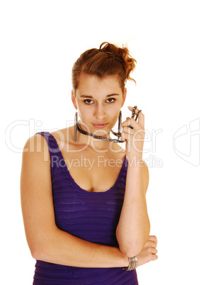 Young woman in dress and necklace.