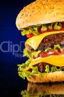 Tasty and appetizing hamburger on a dark blue