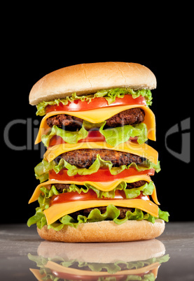 Tasty and appetizing hamburger on a dark