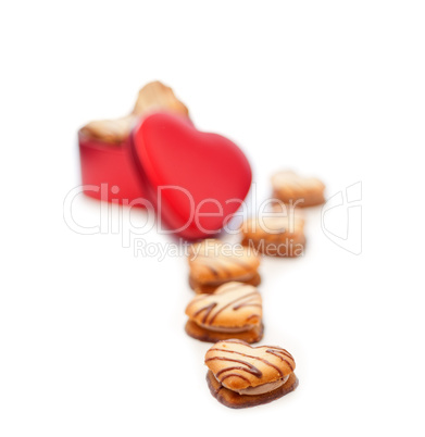 heart shaped cream cookies on red heart metal box