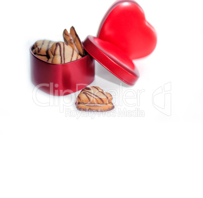 heart shaped cream cookies on red heart metal box