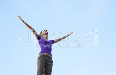 Young woman sitting with raised hand