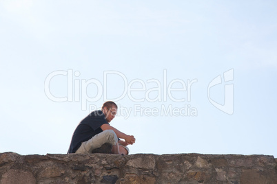 Young man sittting outdoors
