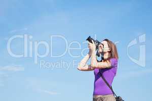 Young lady photographer outdoors