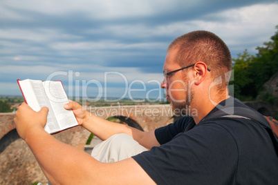 Young man reading the Bible