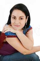 Portrait of a beautiful young woman looking at the camera and sm