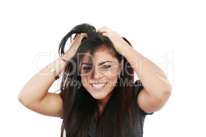 A portrait of a young frustrated woman pulling out hair over whi