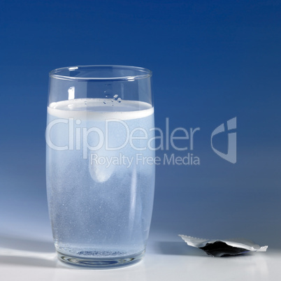 fizzy tablet in a glass of water