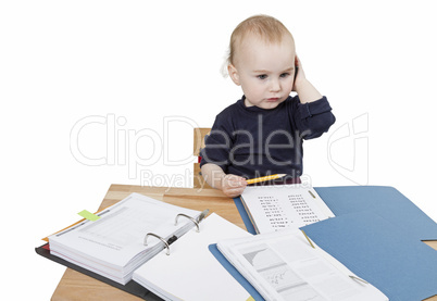 young child at writing desk