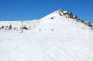 Skiers riding on a slope in Strbske Pleso ski resort, High Tatra