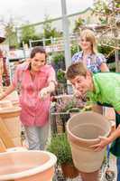 Customers choose flower pots in garden center