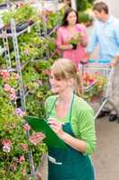 Florist woman make inventory at garden store