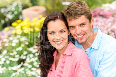 Happy couple embracing in nature garden