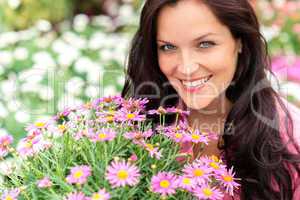 Portrait of beautiful woman with purple flowers