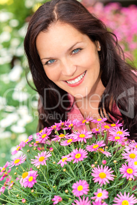 Portrait beautiful woman with purple daisy flowers