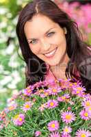 Portrait beautiful woman with purple daisy flowers