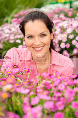 Portrait beautiful woman with purple daisy flowers