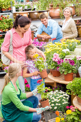 Family garden center shopping for flowers