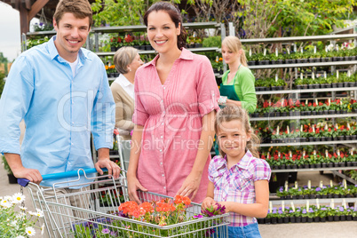 Family shopping flowers at garden center
