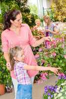 Young woman with daughter visit botanic garden