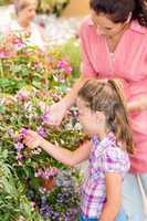 Botanic garden child mother looking at flowers