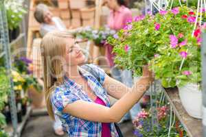 Woman at garden centre shopping for flowers
