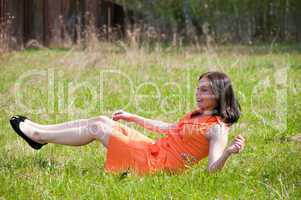 Pretty girl laying on grass