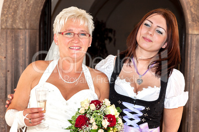 Bride and woman in dirndl