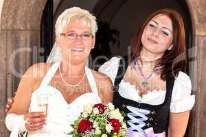 Bride and woman in dirndl