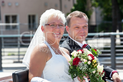 Bride and groom at the horse-drawn carriage ride