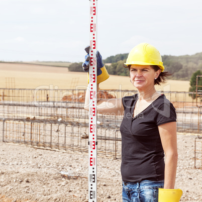 Construction worker on site at the measure