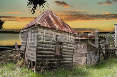 Dilapidated Huts By The Water